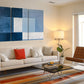 a living room filled with furniture and a painting on the wall
