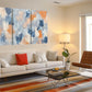 a living room filled with furniture and a painting on the wall