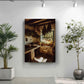 a rustic kitchen with a window, hanging plants, and a potted plant on a shelf.