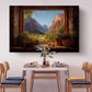 a dining table set with plates, silverware, and a vase of flowers, with a large painting of a mountain landscape hanging above it.