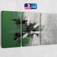 a green and white abstract painting on a wall