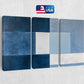 a blue and white abstract painting on a wall