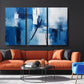 a living room with a couch, chair and painting on the wall