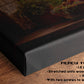 The image is a close-up of a black canvas print with a painting of a garden scene on it, placed on a wooden surface.