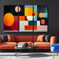 a living room with a couch a chair and a painting on the wall