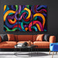 a living room filled with furniture and a painting on the wall